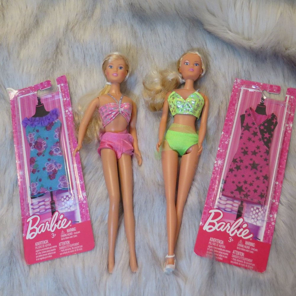 Two Bikini Barbie's with unopened new dresses